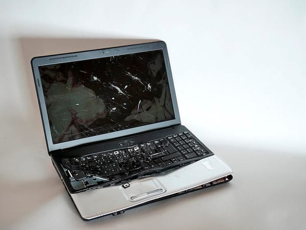 A busted-up laptop computer.