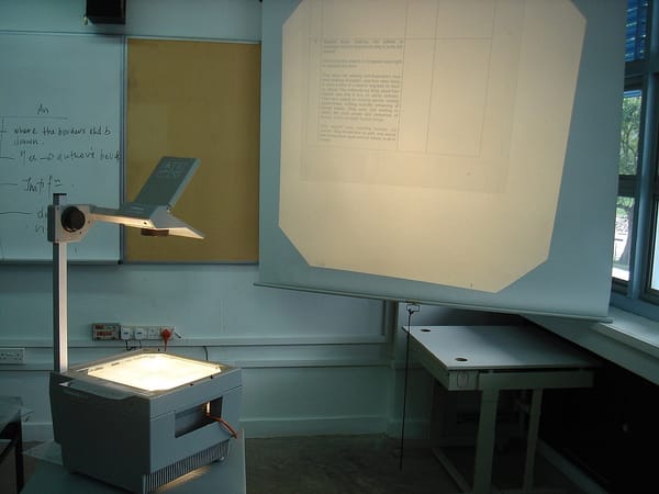 Photo of an overhead projector showing a transparency.