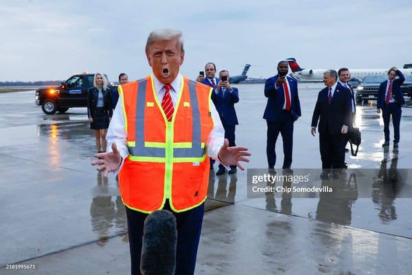 Donald Trump wearing far too much spray tan on his face.